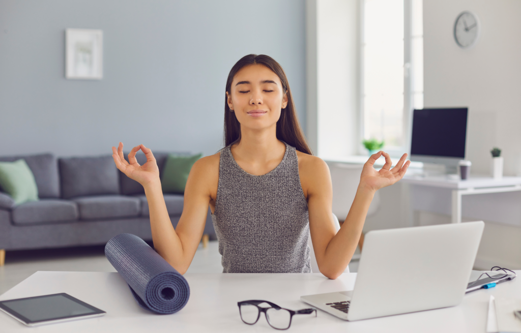 a girl meditating while working